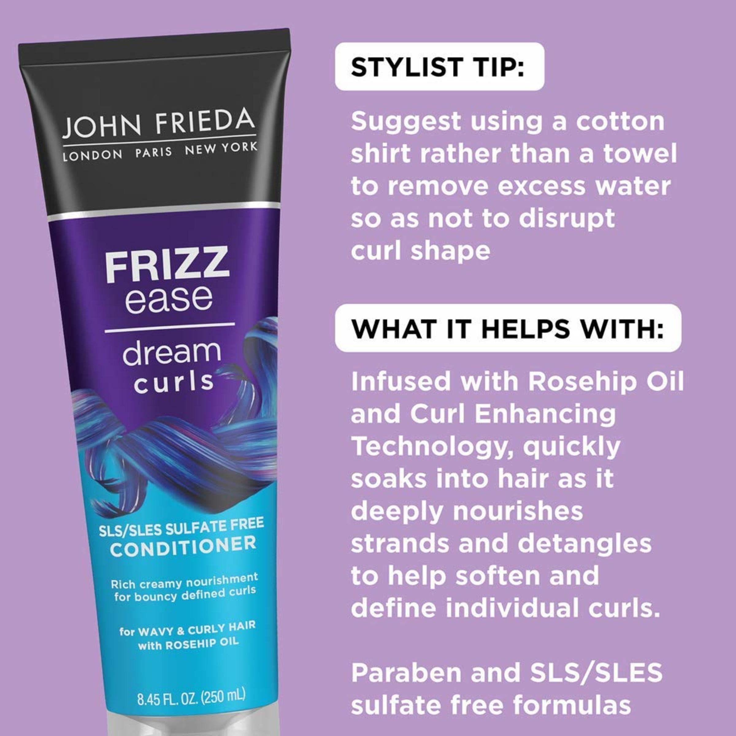 Hands applying conditioner to curly hair for smoother detangling.
