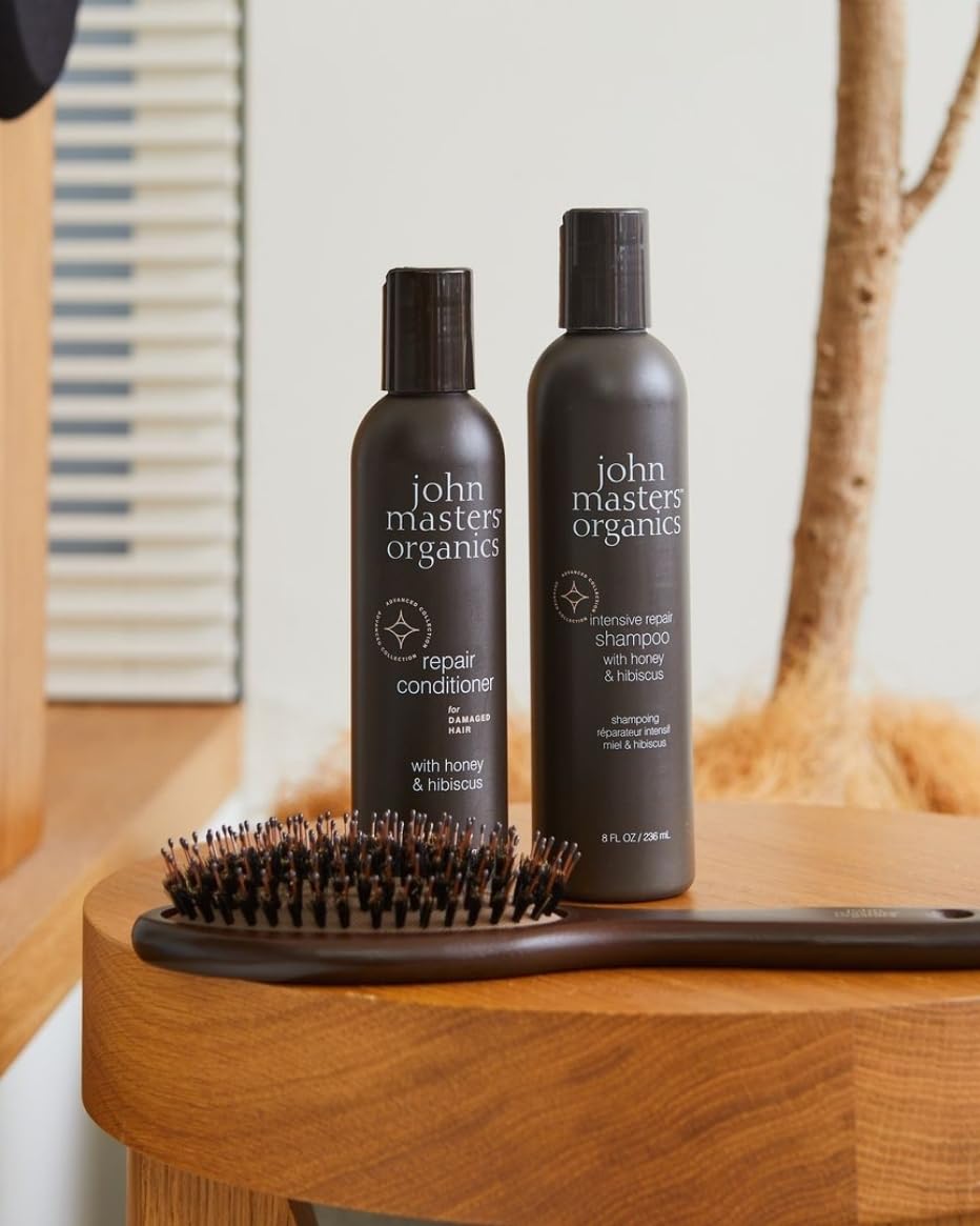 John Masters Organics Repair Conditioner application on hands demonstrates easy distribution.