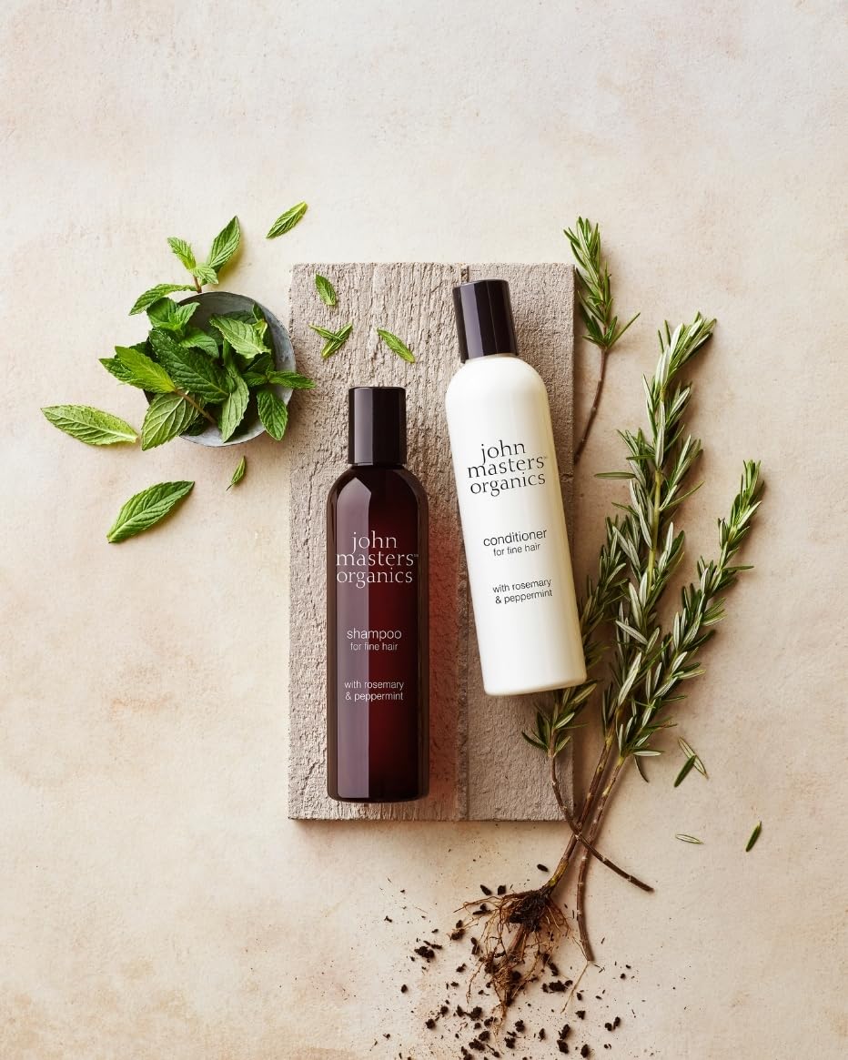 John Masters Organics volumizing conditioner label highlighting rosemary and peppermint benefits