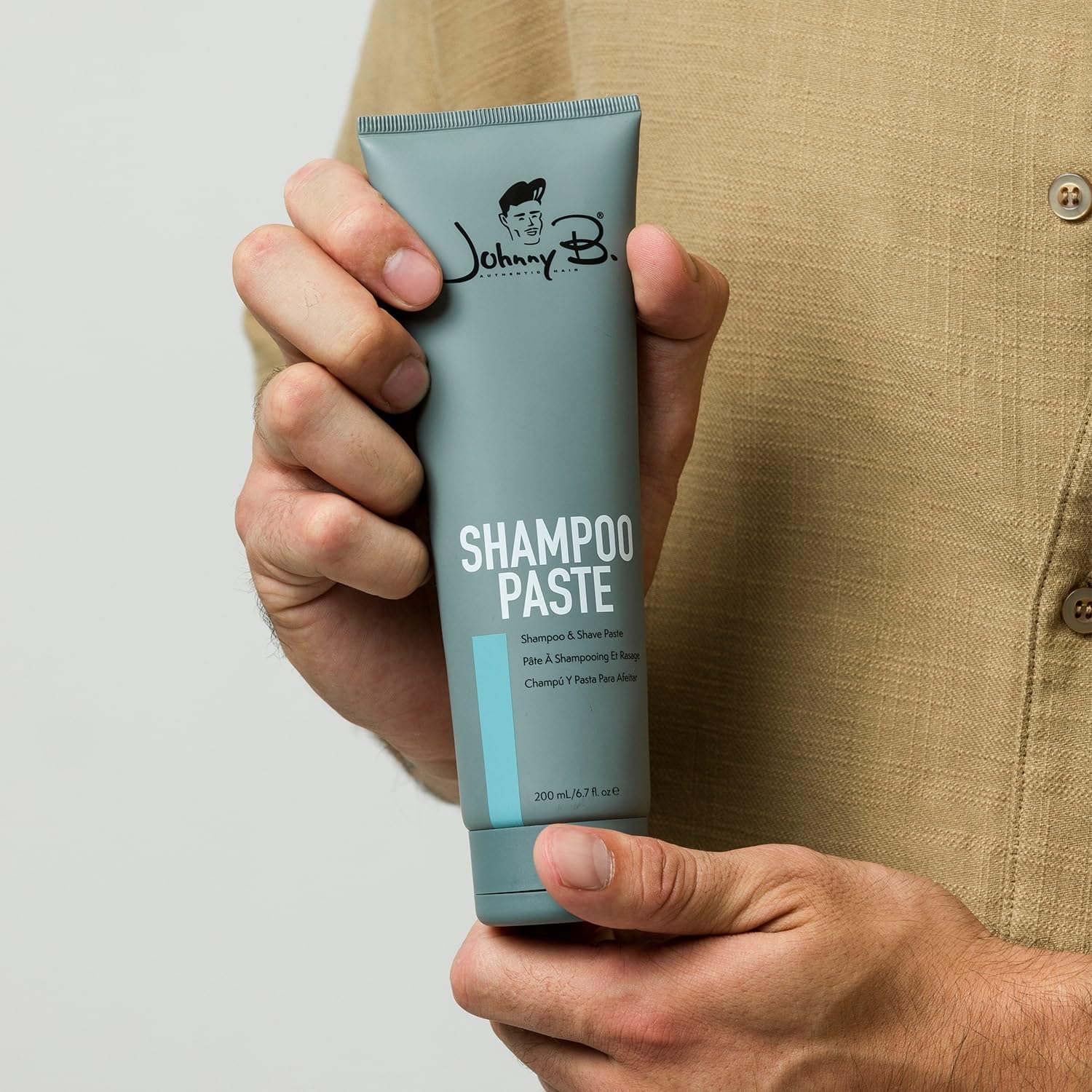 Johnny B. Shampoo Paste packaging shows a 6.7 oz tube for easy use.
