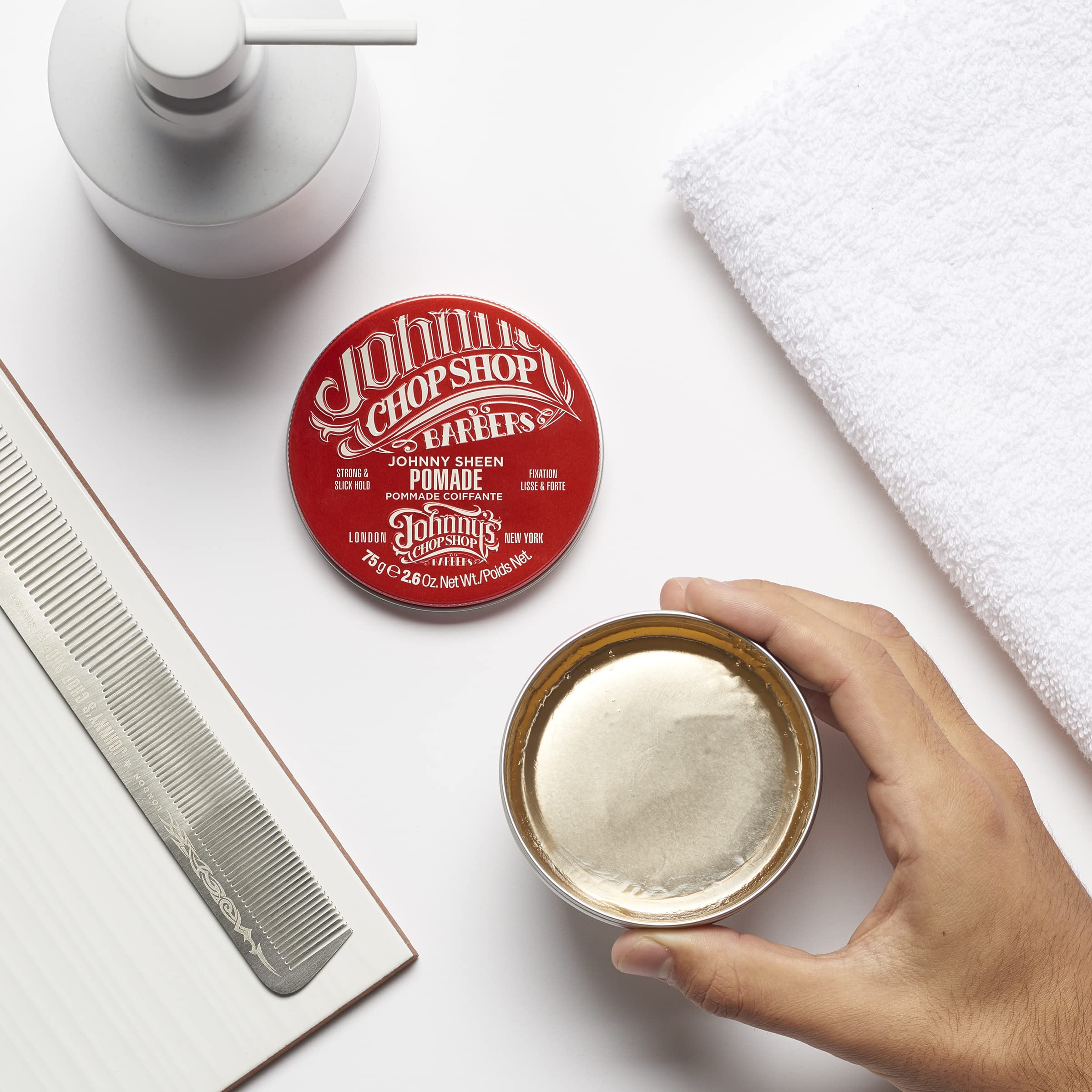 Johnny's Chop Shop hands applying pomade demonstrate easy application.