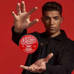 Johnny's Chop Shop hair style shot demonstrates versatile hold for vintage looks.