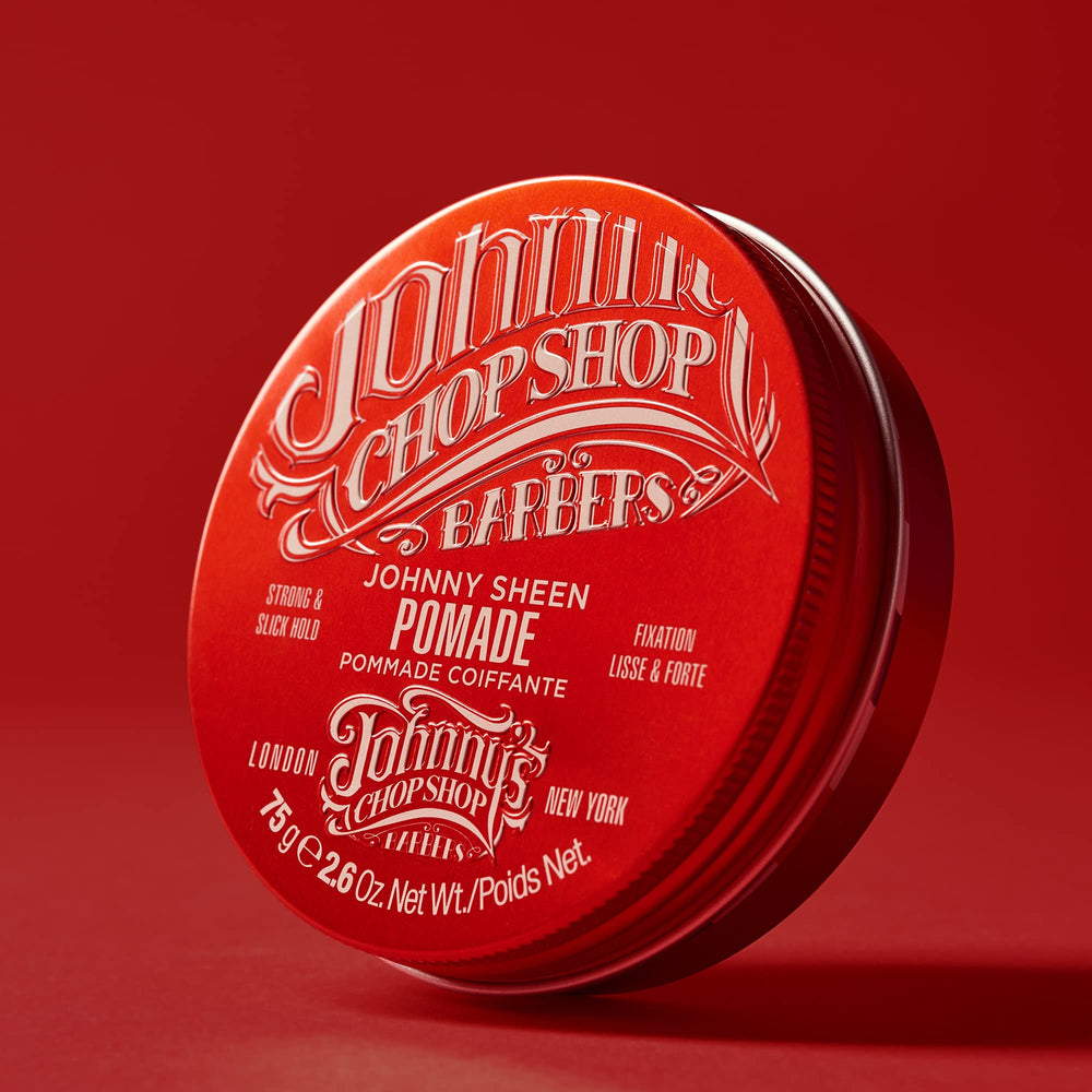 Johnny's Chop Shop pomade label close-up highlights high-shine formula for smooth style.