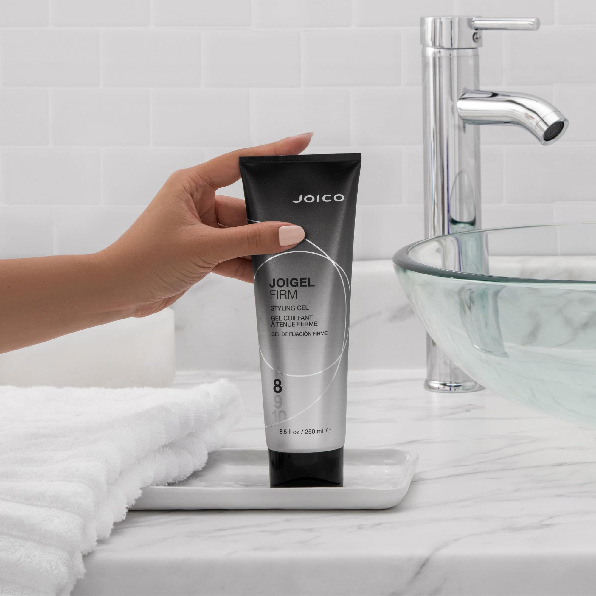 In-hand Joico JoiGel Firm styling gel application for easy styling.