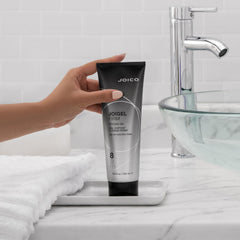 In-hand Joico JoiGel Firm styling gel application for easy styling.