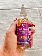 Joli Faire Hair Growth Oil bottle being poured for scalp nourishment.