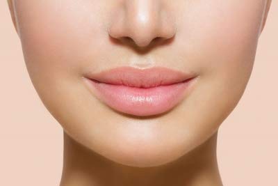 Jolie Vitamin E Lip Conditioner Stick in use to hydrate and soften creases.