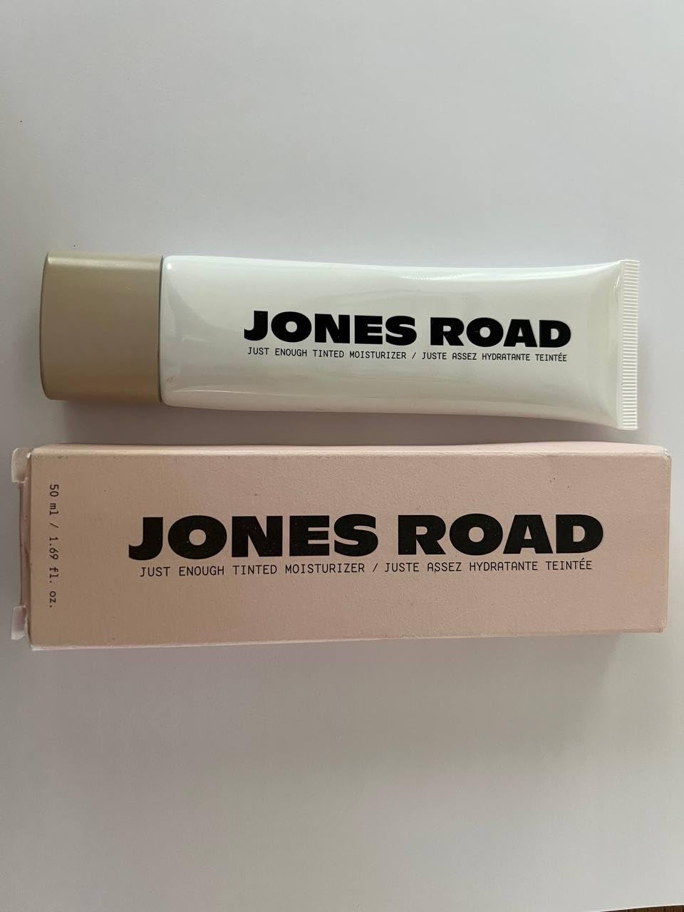 Jones Road Just Enough Tinted Moisturizer Porcelain bottle delivers lightweight hydration and a natural finish