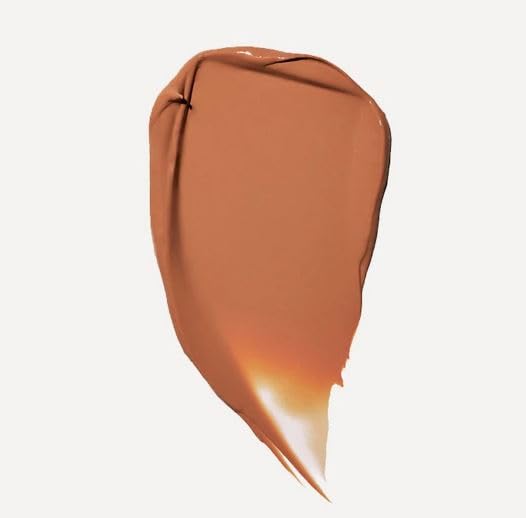 Jones Road What The Foundation Medium tint application spatula for precise dosing.