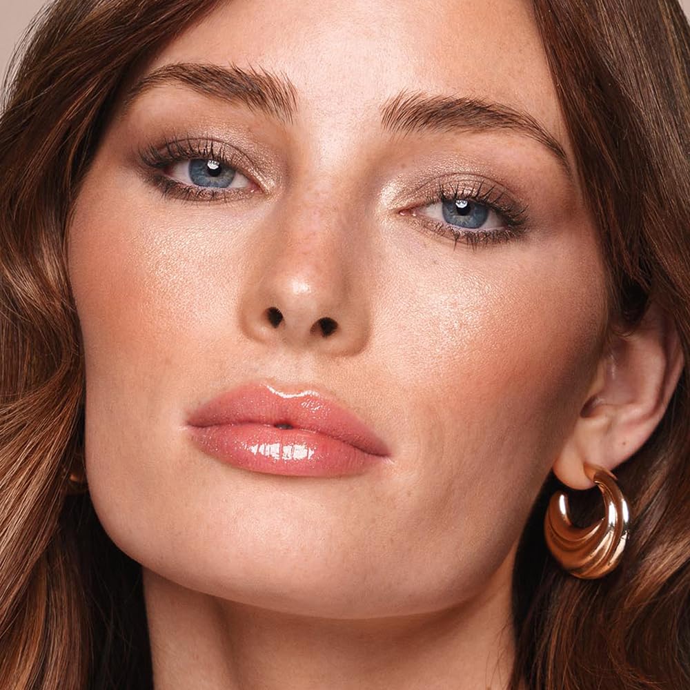 Jouer Long Wear Lip Topper glides on smoothly for non-sticky shine.