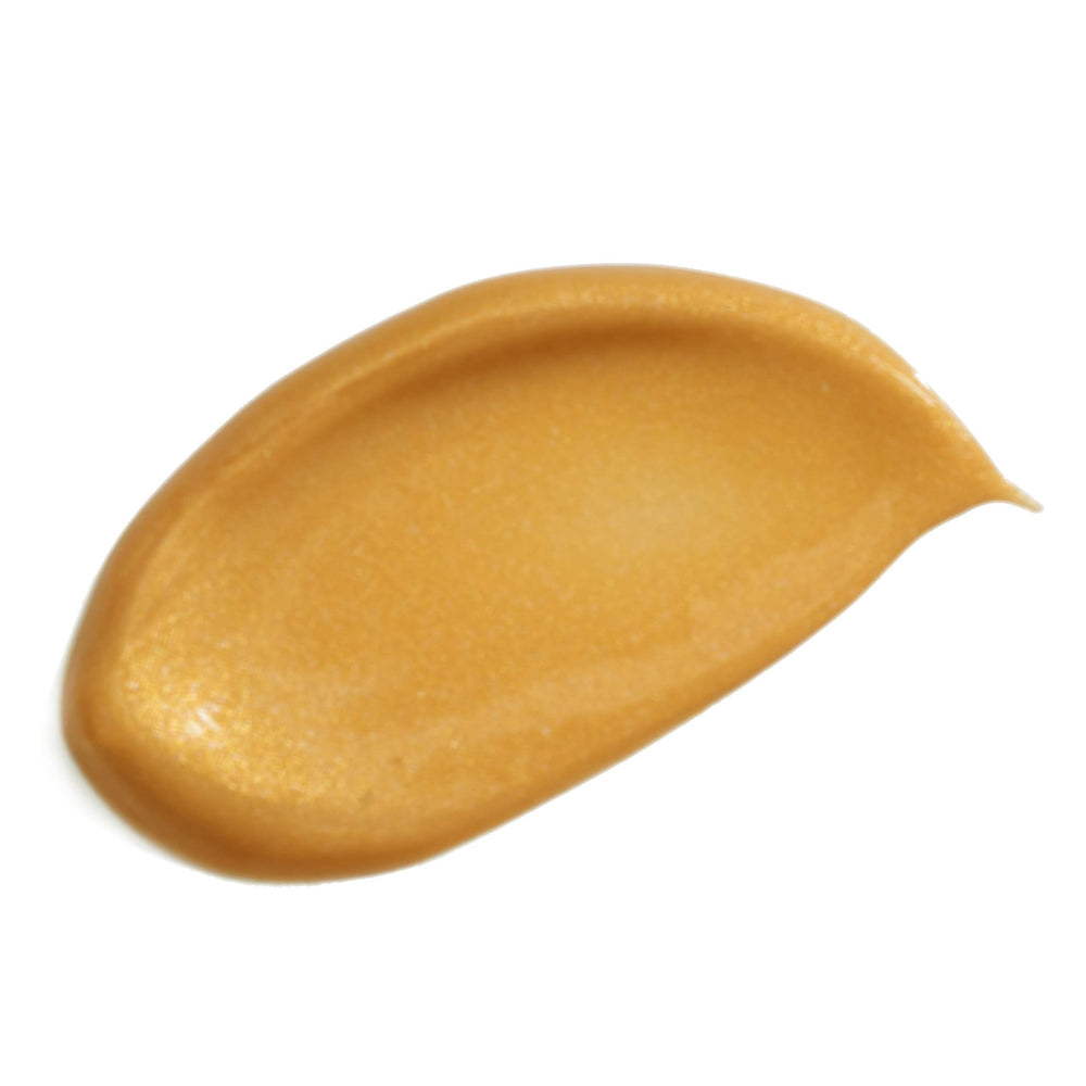 Juicy Skin Care Body Shimmer on leg for shimmering, smooth skin.