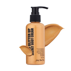 Juicy Skin Care Gold Glitter Up Secret bottle close-up showing shimmering glow