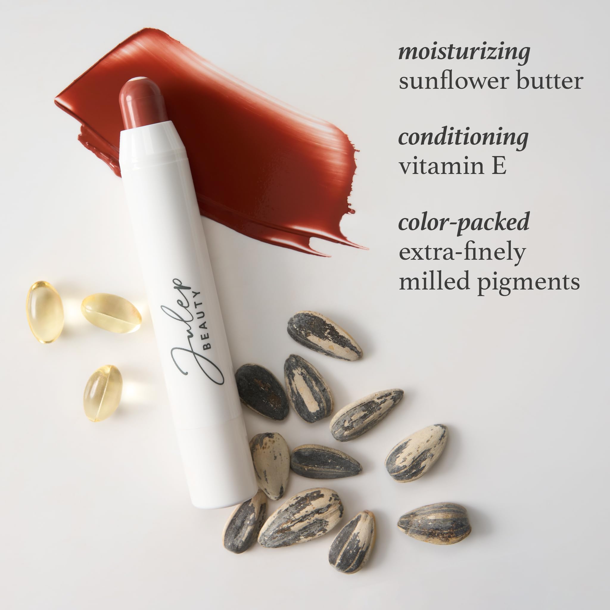 Julep almond nude shade swatch on lips with glossy hydration.