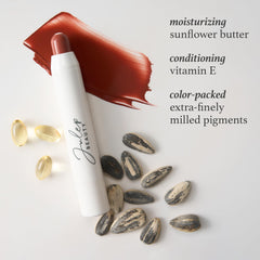 Julep almond nude shade swatch on lips with glossy hydration.