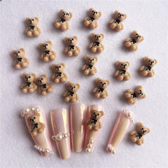 JUNCHAO brown bear nail charms with black bow add chic winter appeal to nails