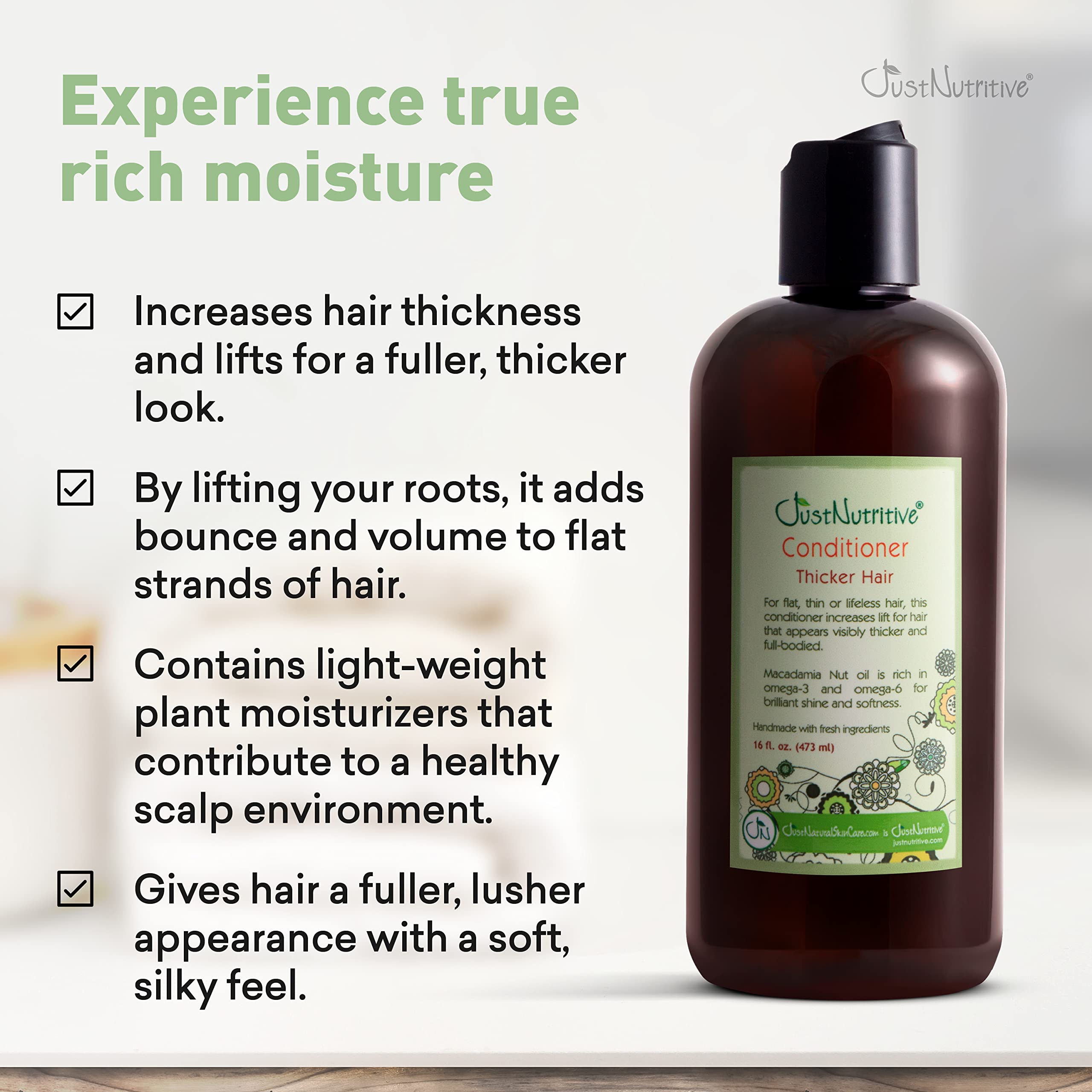 Just Nutritive Thicker Hair Conditioner creamy texture swatch demonstrates smooth application.