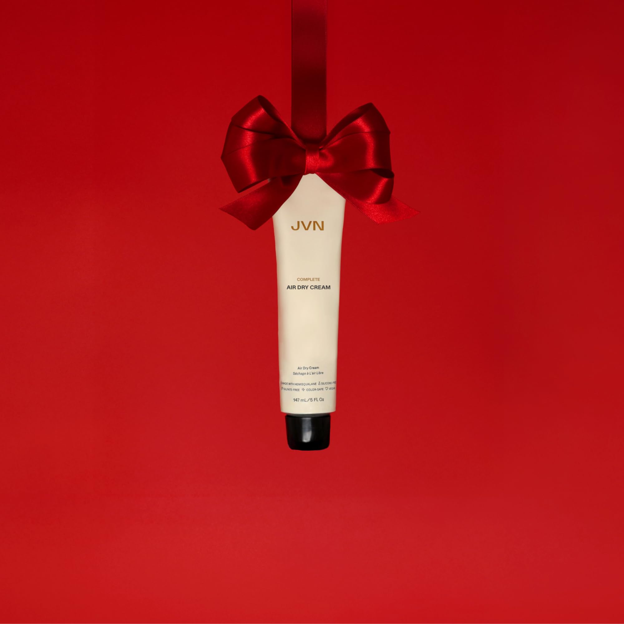 JVN No Heat Air Dry Cream in hand demonstrates easy distribution for natural texture