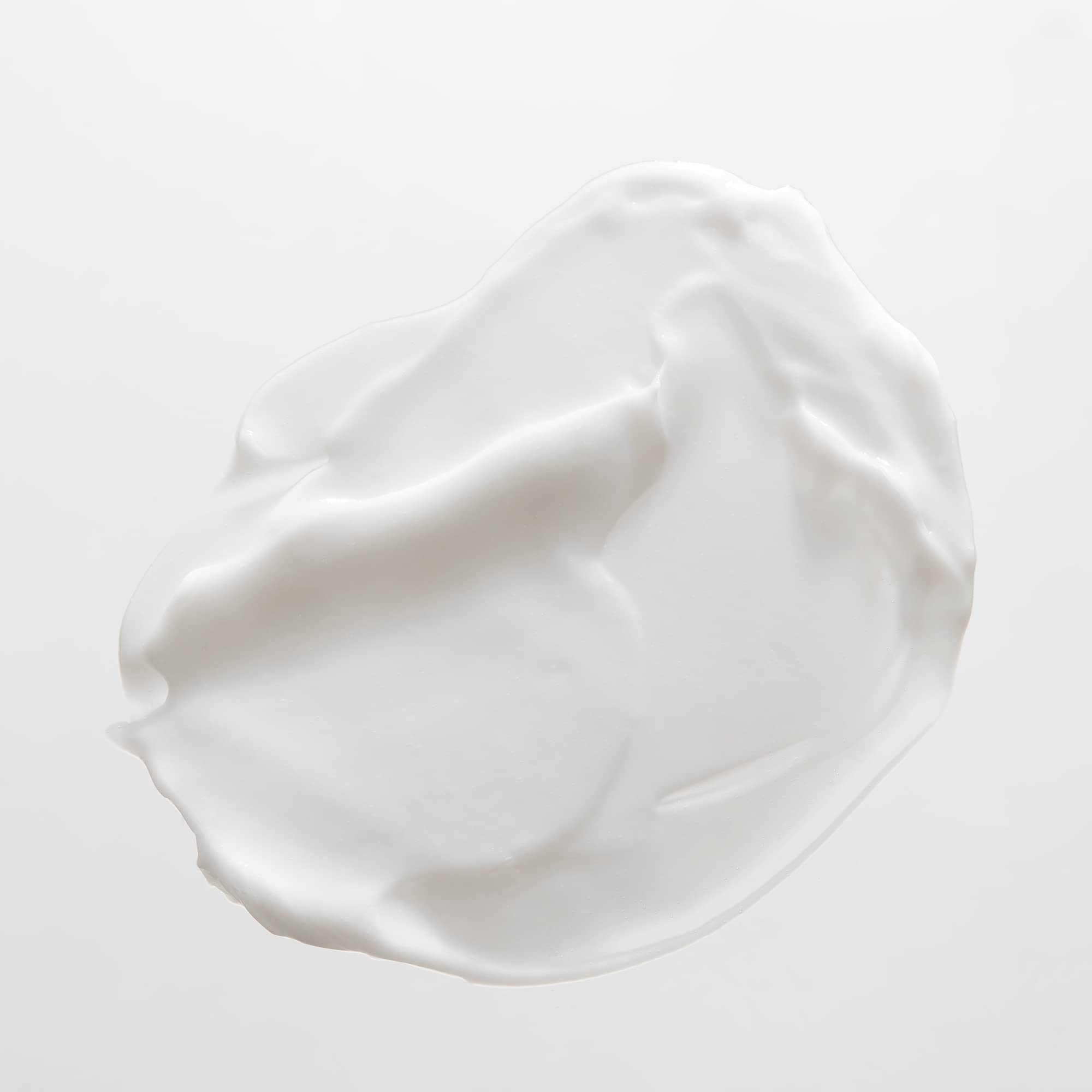 JVN Revive Repairing Conditioner bottle beside smooth, manageable hair