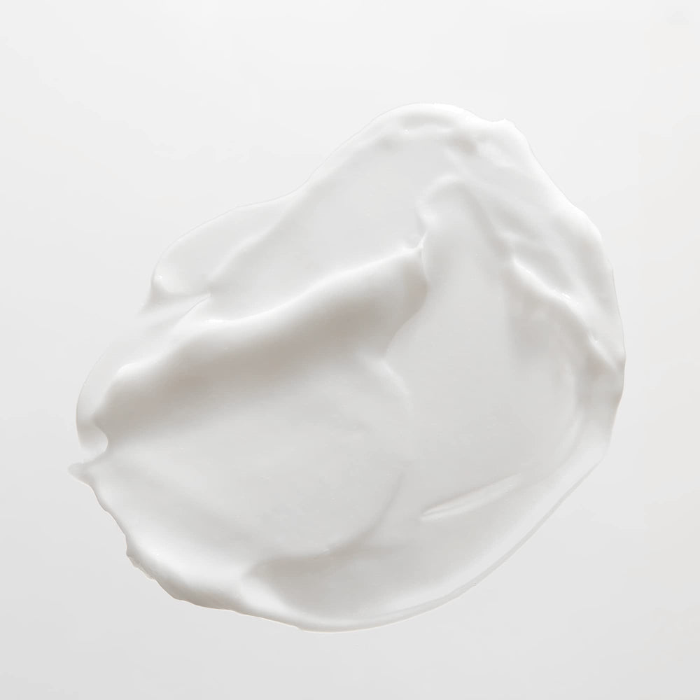 JVN Revive Repairing Conditioner bottle beside smooth, manageable hair