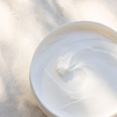 Kai body butter applied to forearm demonstrates smooth, fast-absorbing hydration