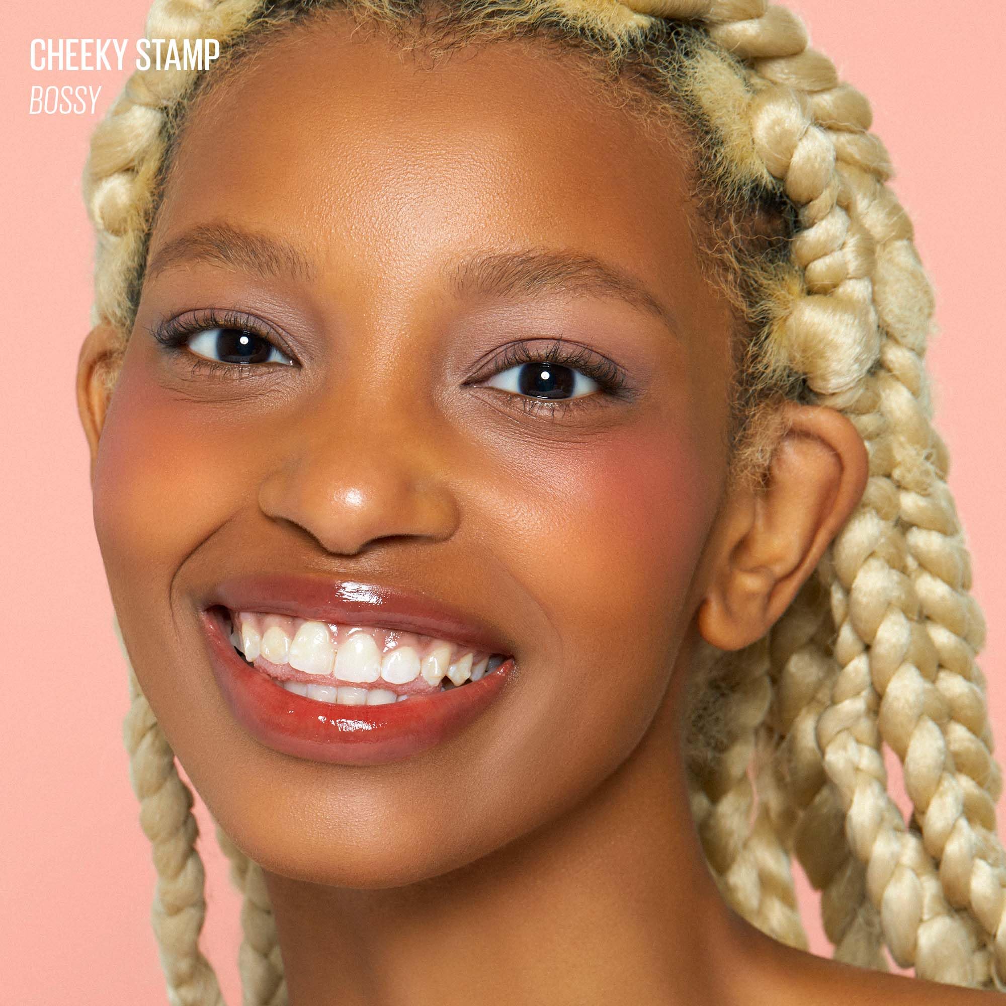 KAJA Cheeky Stamp applying Bossy blush on the apples of the cheeks