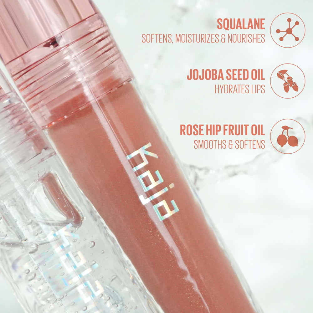 Kaja Gloss Shot 03 Honey Drizzle includes jojoba oil for soft, nourished lips.