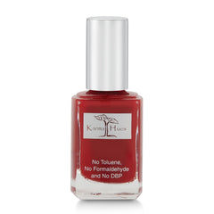 Karma Naturals Nail Polish Bordeaux bottle shows a non-toxic vegan formula.