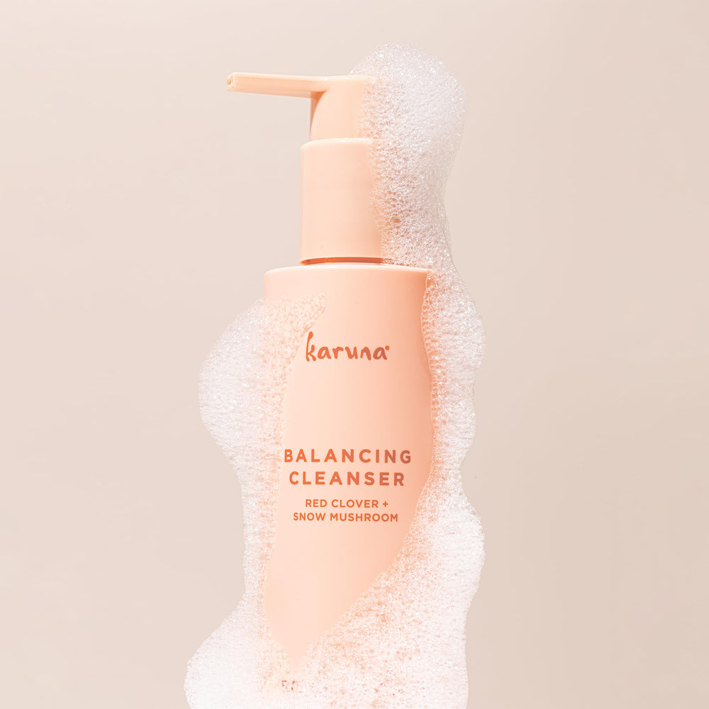 Karuna Balancing Facial Gel Cleanser foamy lather on skin.