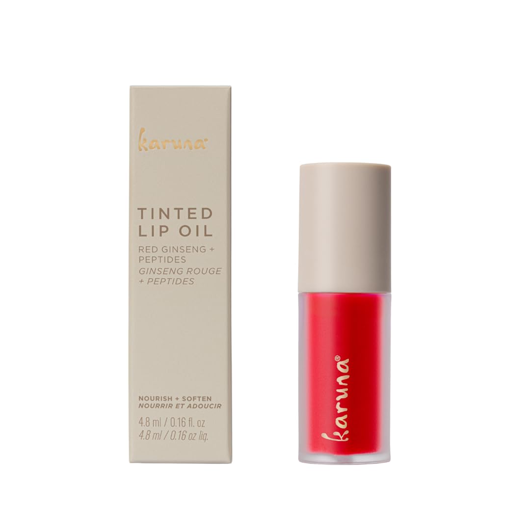 Karuna Skin Embrace lip oil swatch on lips shows subtle color and shine.