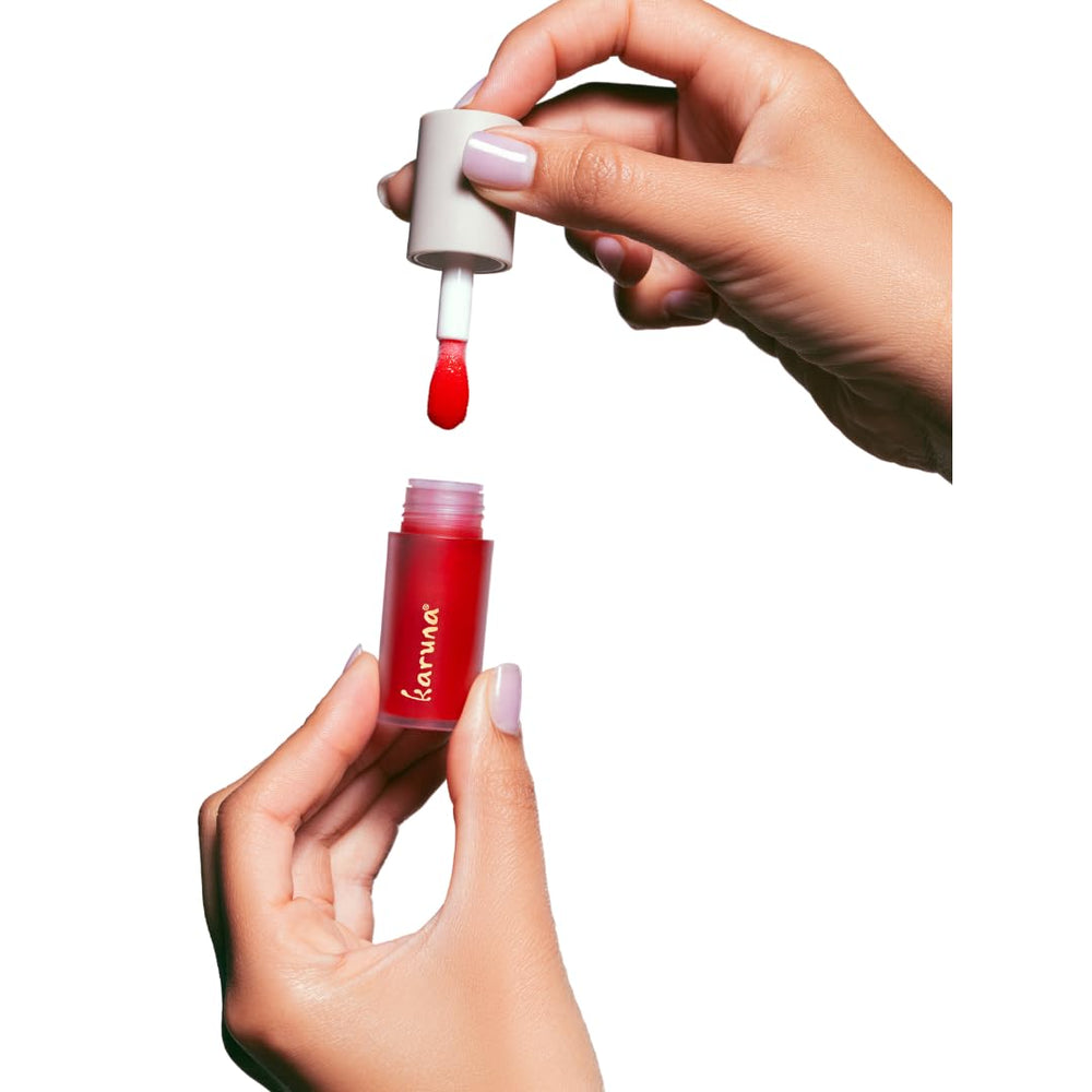 Karuna Lip Oil Embrace texture drop reveals silky, non-sticky feel.