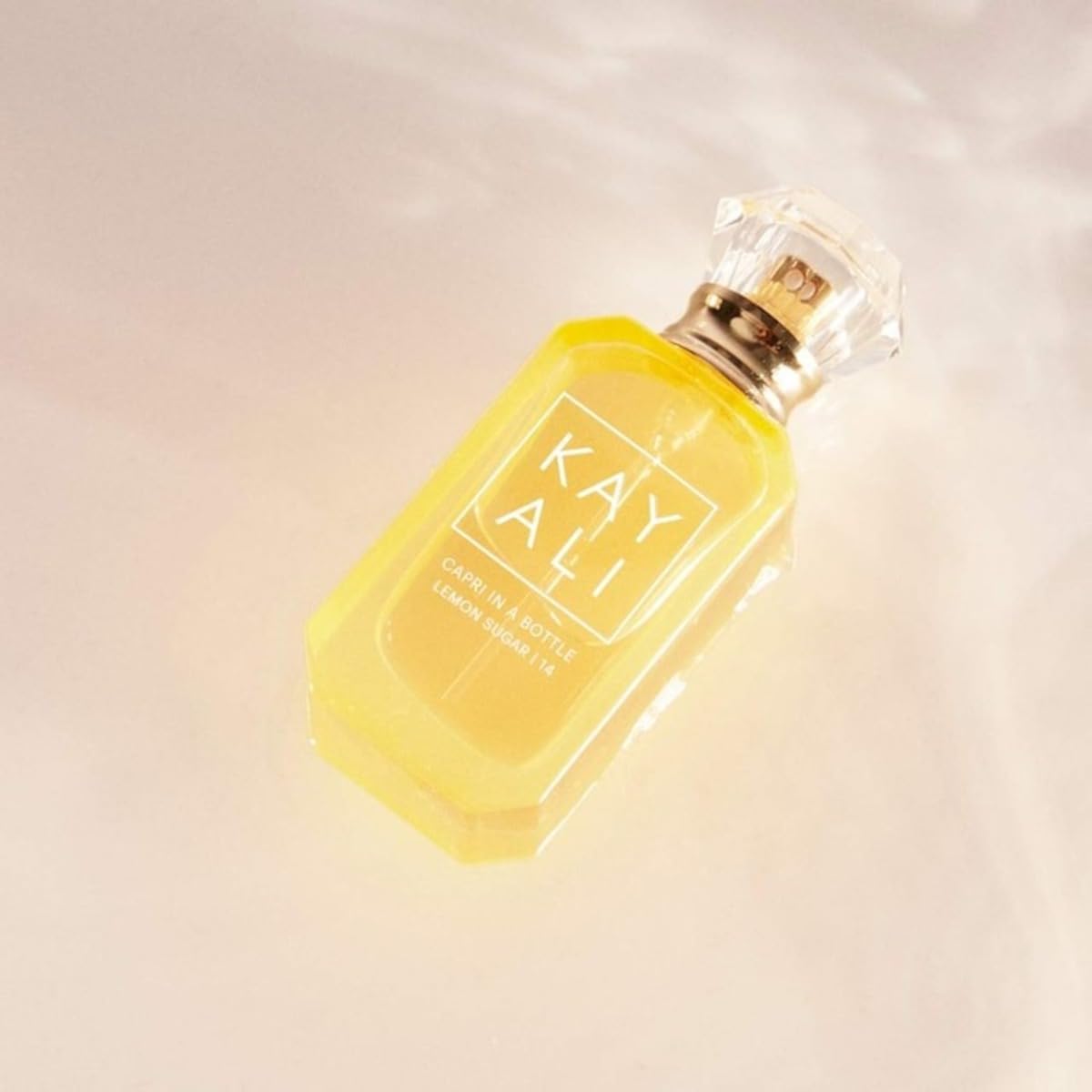 Kayali Capri Lemon Sugar fragrance swatch on skin reveals warm, sweet aura.