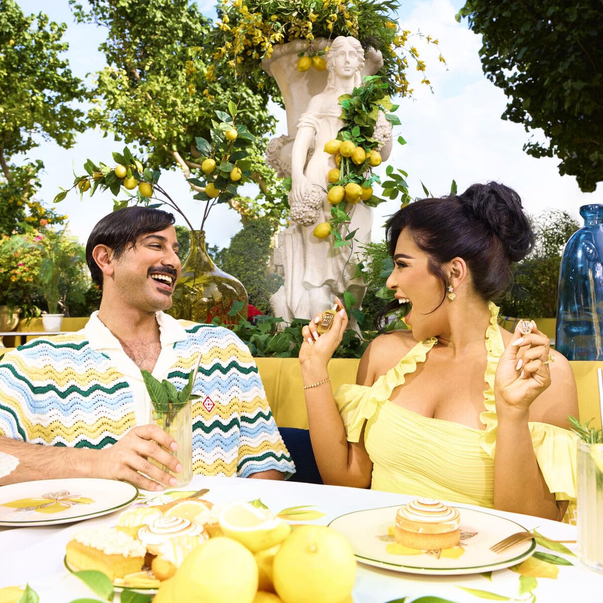Kayali Capri Lemon Sugar lifestyle shot with citrus brightness and cozy vibes.