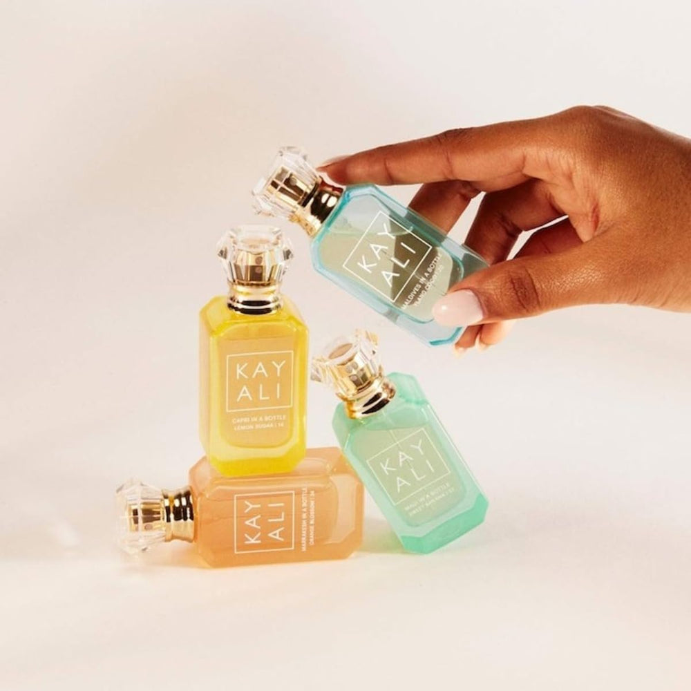 Kayali Capri Lemon Sugar compact travel bottle for on-the-go fragrance.