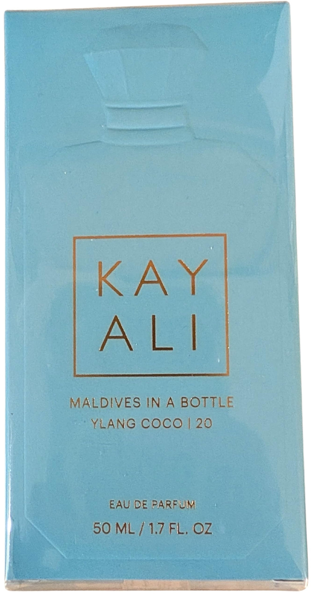 Kayali Maldives Ylang Coco bottle on shelf, evokes a tropical mood and ocean-inspired vibe.