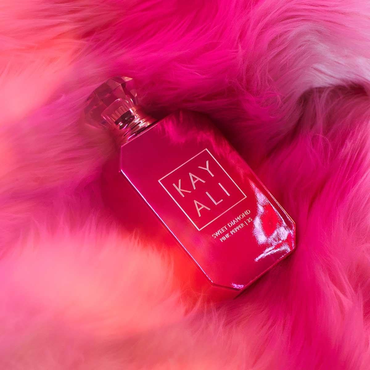 KAYALI Sweet Diamond Pink Pepper in a purse-ready setup for daily wear
