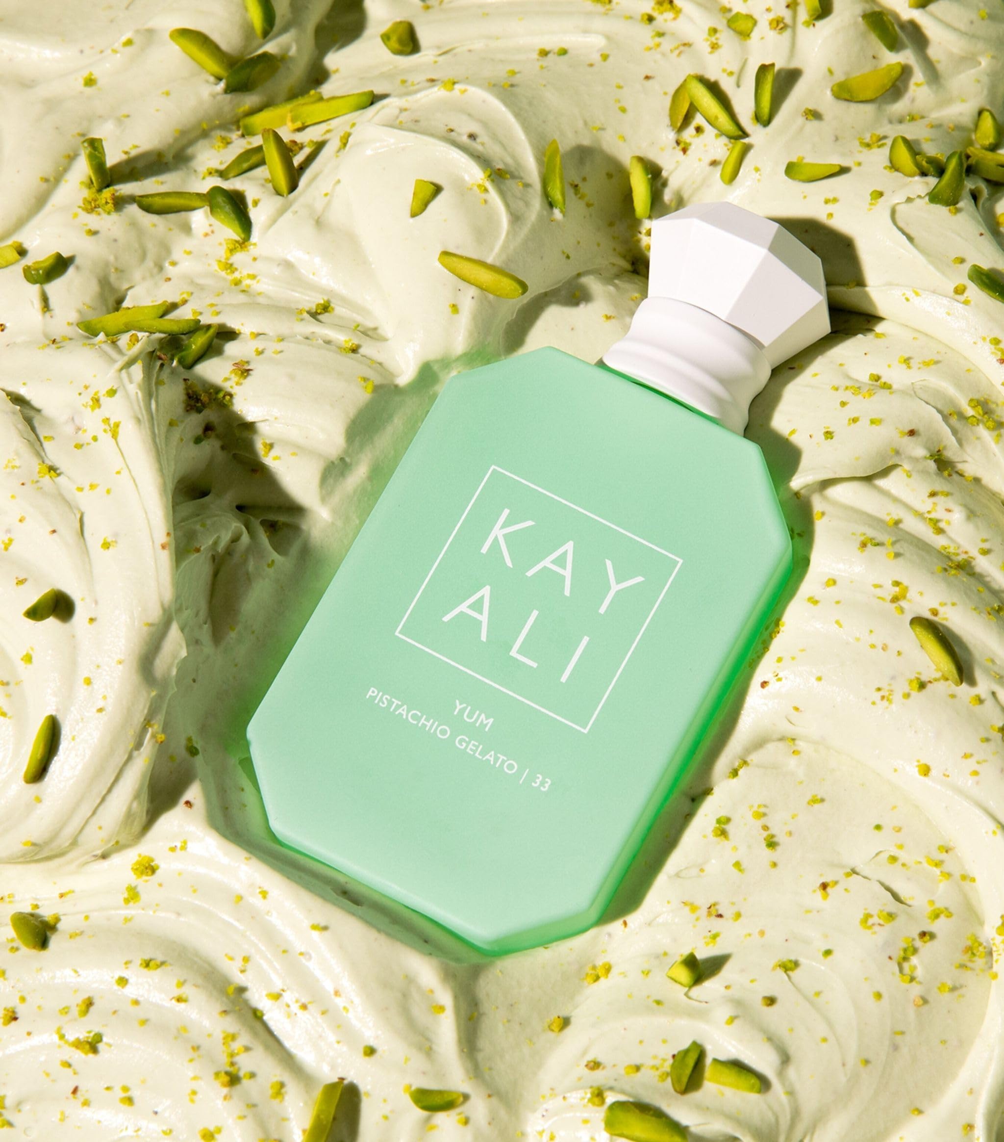 KAYALI Yum Pistachio Gelato 33 EDP Intense close-up, premium scent presentation.