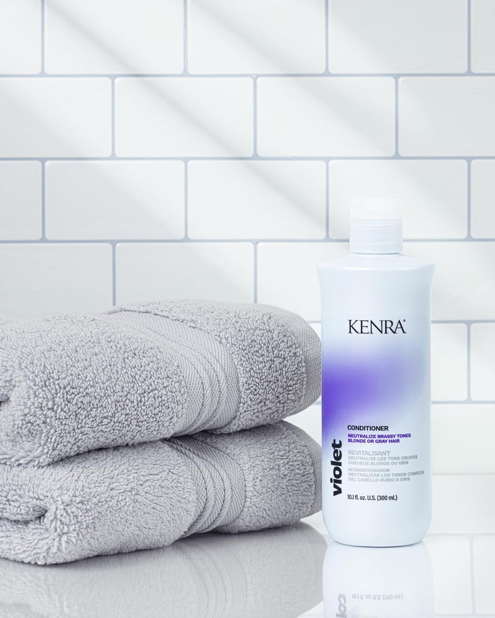 Kenra Violet Conditioner bottle on sink signals moisture and vibrancy for processed hair
