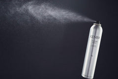 Kenra Volume Spray 25 spraying action showing long-lasting hold against wind