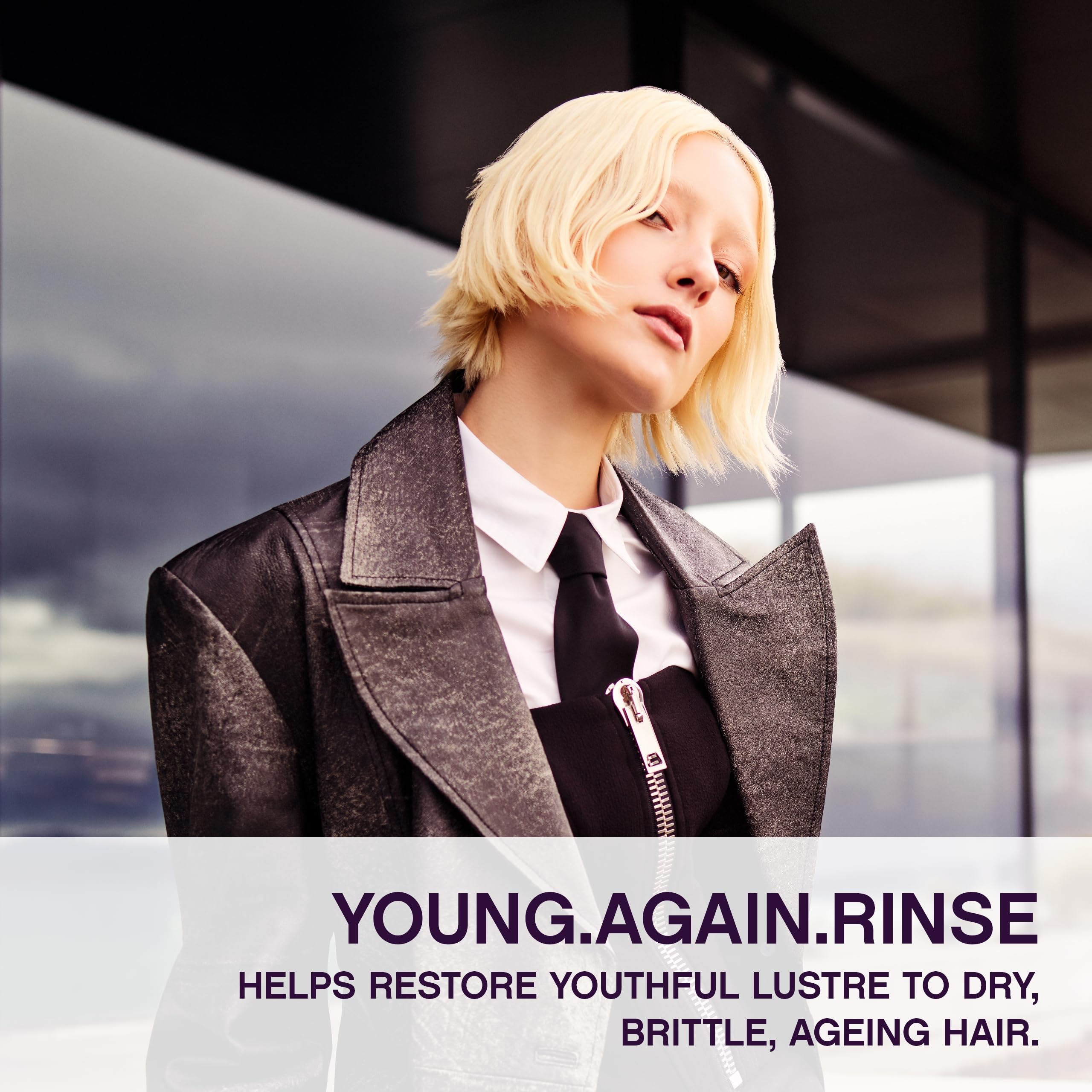 KEVIN.MURPHY Young.Again.RINSE bottle side emphasizes lightweight conditioning for brittle, dry strands.