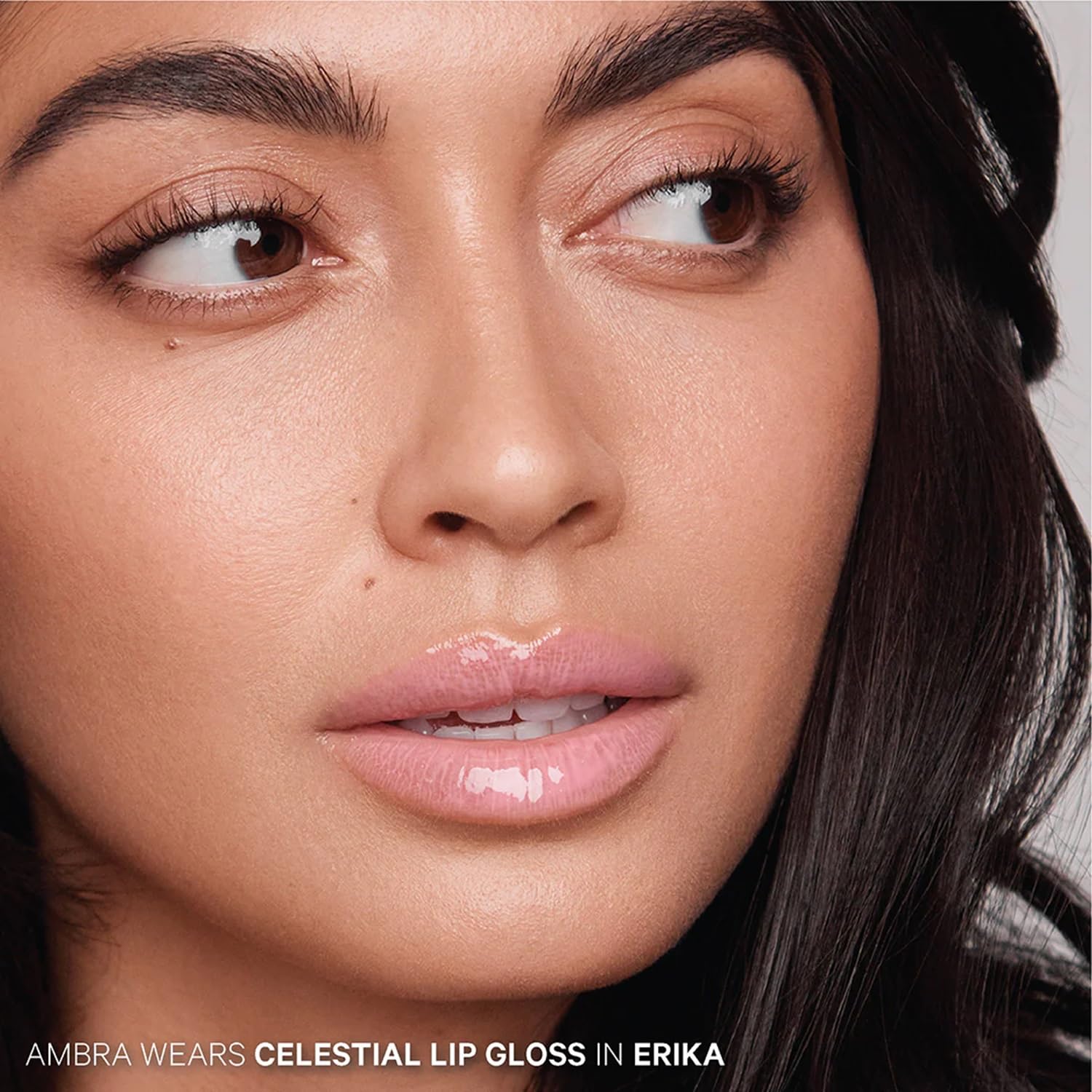 Kevyn Aucoin Celestial Lip Gloss Erika curved applicator in use.