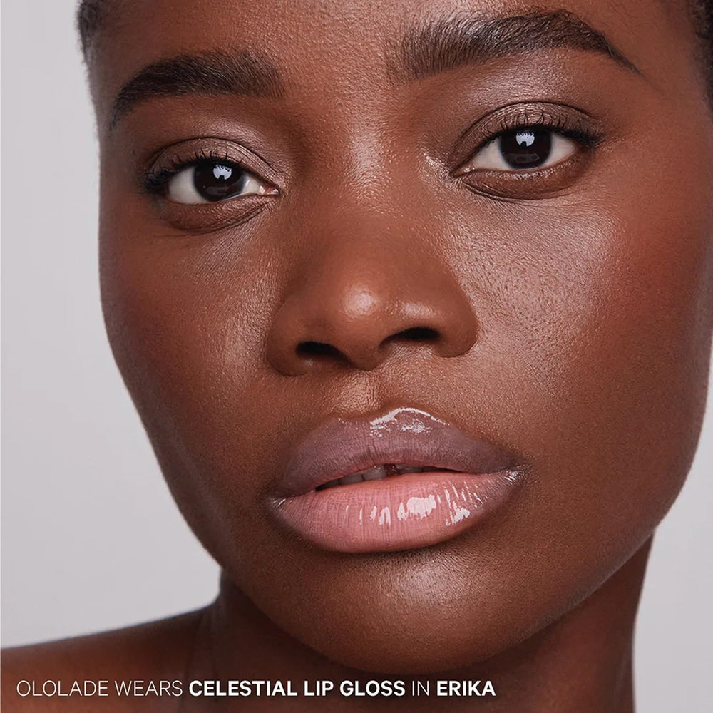 Kevyn Aucoin Celestial Lip Gloss Erika on lips with light-reflecting shine.