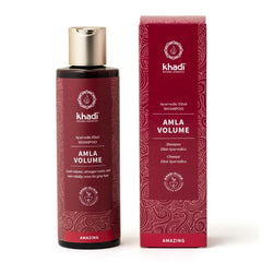 KHADI Amla Volume shampoo bottle being poured for root strength and volume.