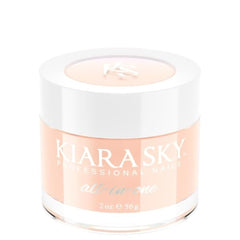 Kiara Sky Autumn Blonde cover powder bottle highlights a smooth nude warmth for nails.