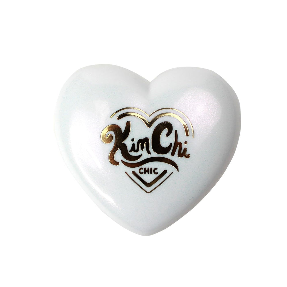 Kimchi Chic Pearl Gone Wild Highlighter uses the mirror for finishing touches on eyes