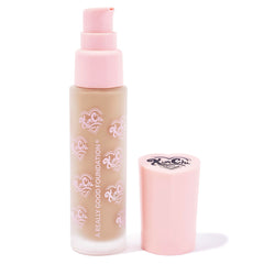 Kimchi Chic foundation bottle cap closeup shows secure cap and travel-friendly design.