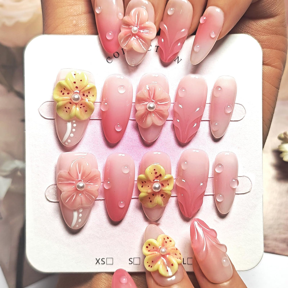 KimKista almond press-on nails with pink ombre and 3D flowers for a chic look