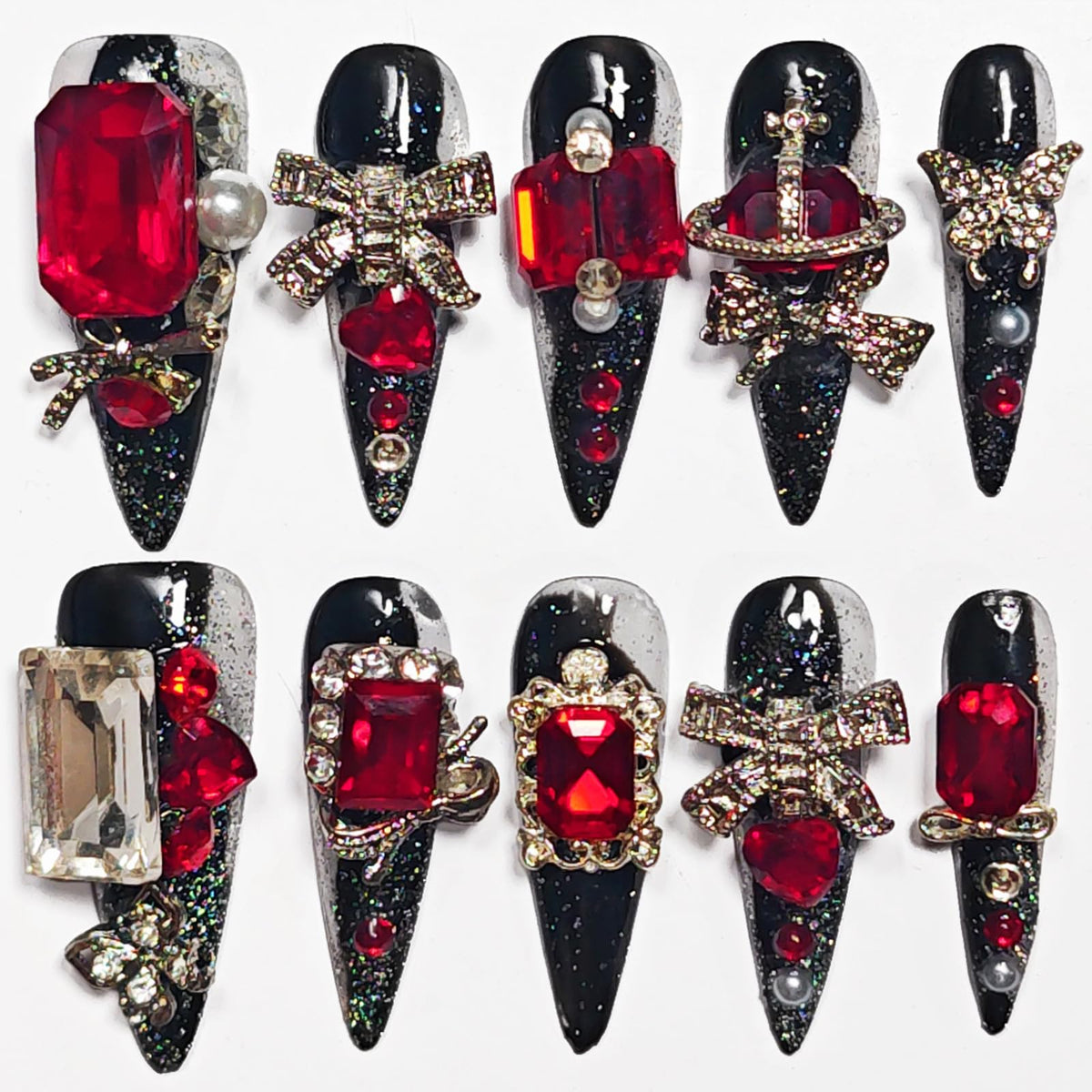 KimKista handmade stiletto nails in black with red rhinestones for dramatic Gothic style