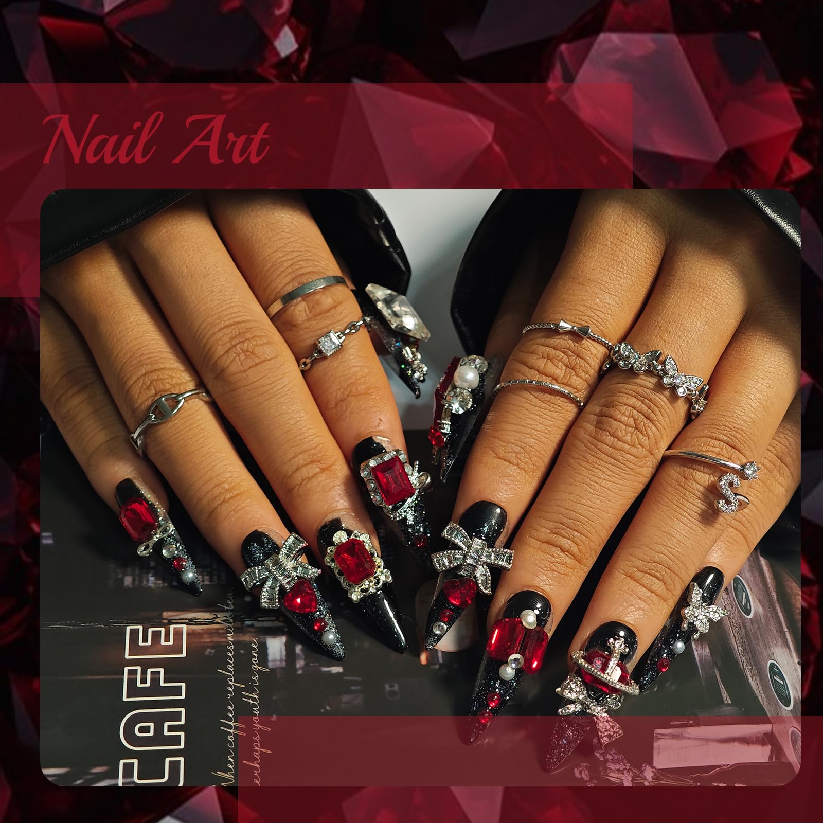 KimKista nails featuring red rhinestones on a black base for bold wear