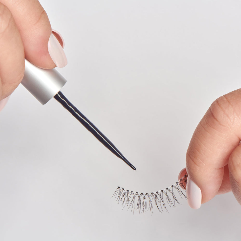 KISS Black formula adhesive bottle signals bold lash look and strong adherence.