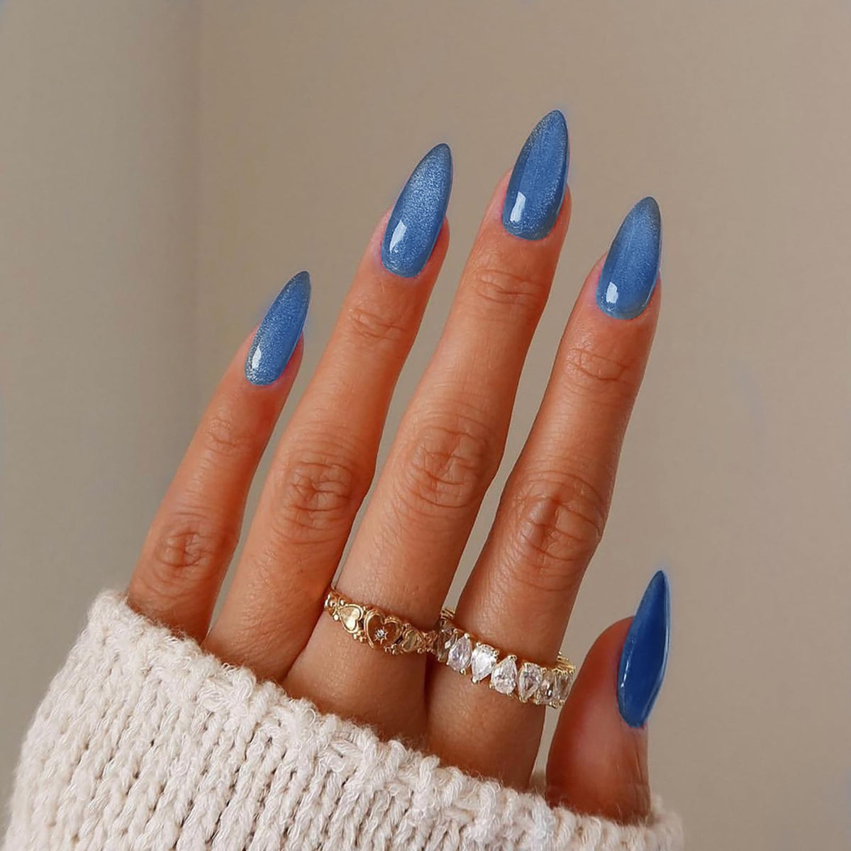 KKUUOO blue press-on nails in almond shape for a stylish manicure.